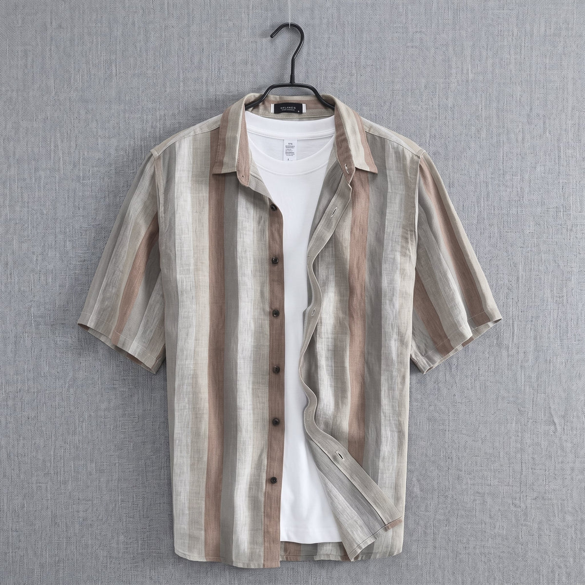 Cortez Men's Linen Button-Up Shirt in Brown on a hanger against a light wall