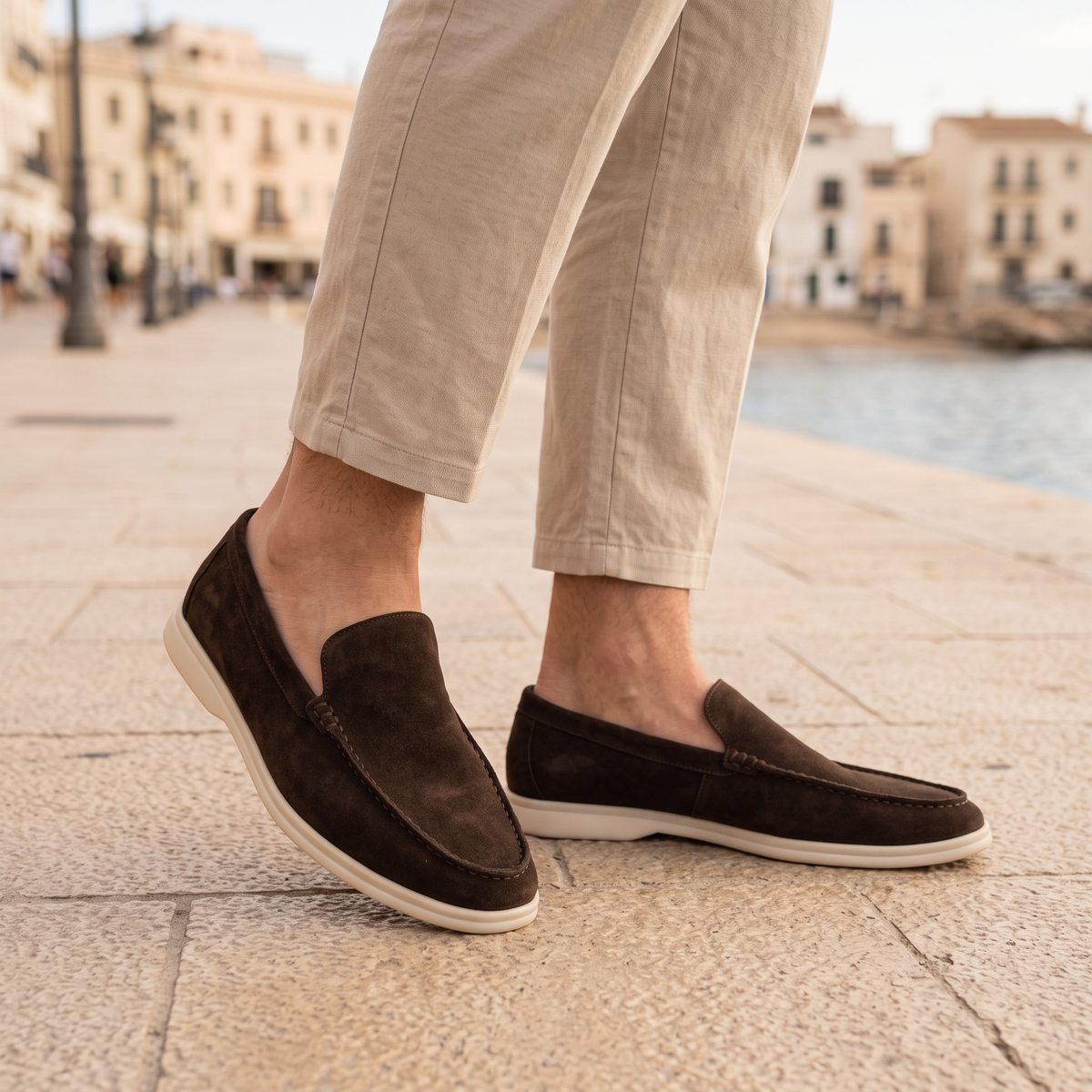 Everett Men's Slip-On Loafers in brown on a beachside town promenade