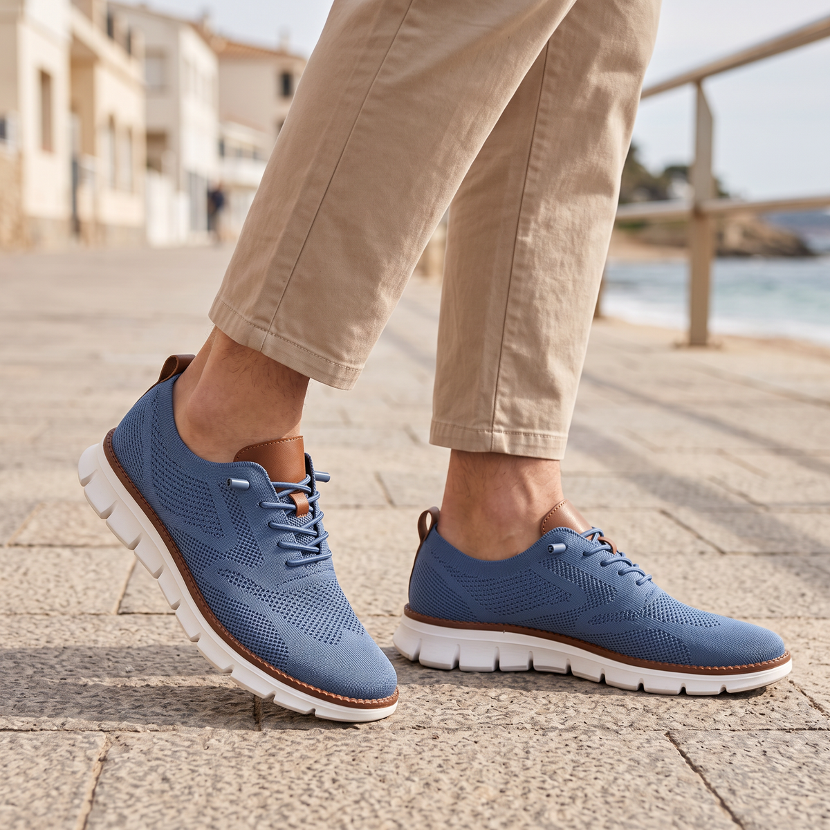 Maddox Men's Lace-Up Casual Sneakers in blue on a beachside town promenade