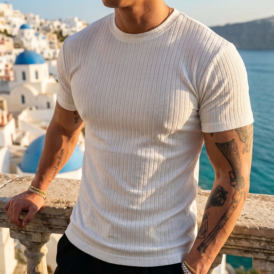 Bexley Men's Ribbed Stretch Crew Tee worn on a terrace overlooking a coastal town