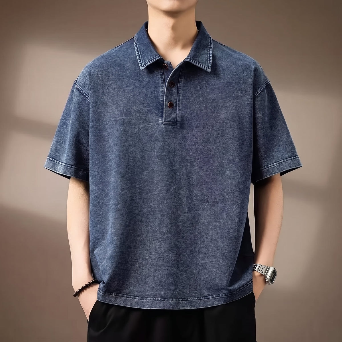 Bryson Men's Denim Polo Shirt worn by a model against a warm taupe studio background