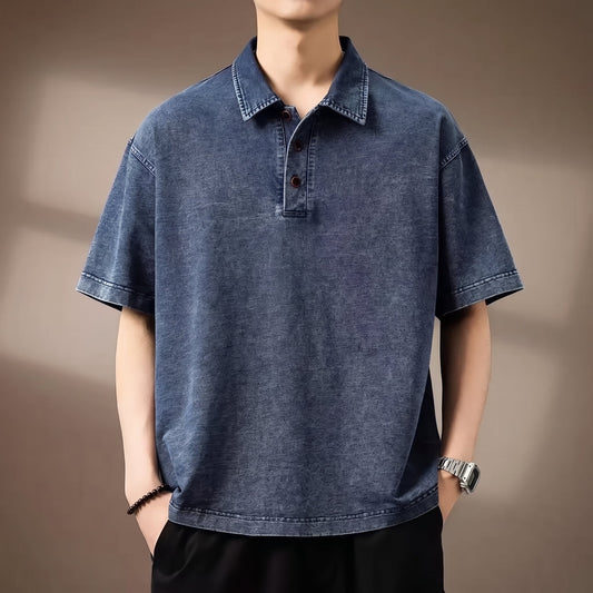 Bryson Men's Denim Polo Shirt worn by a model against a warm taupe studio background