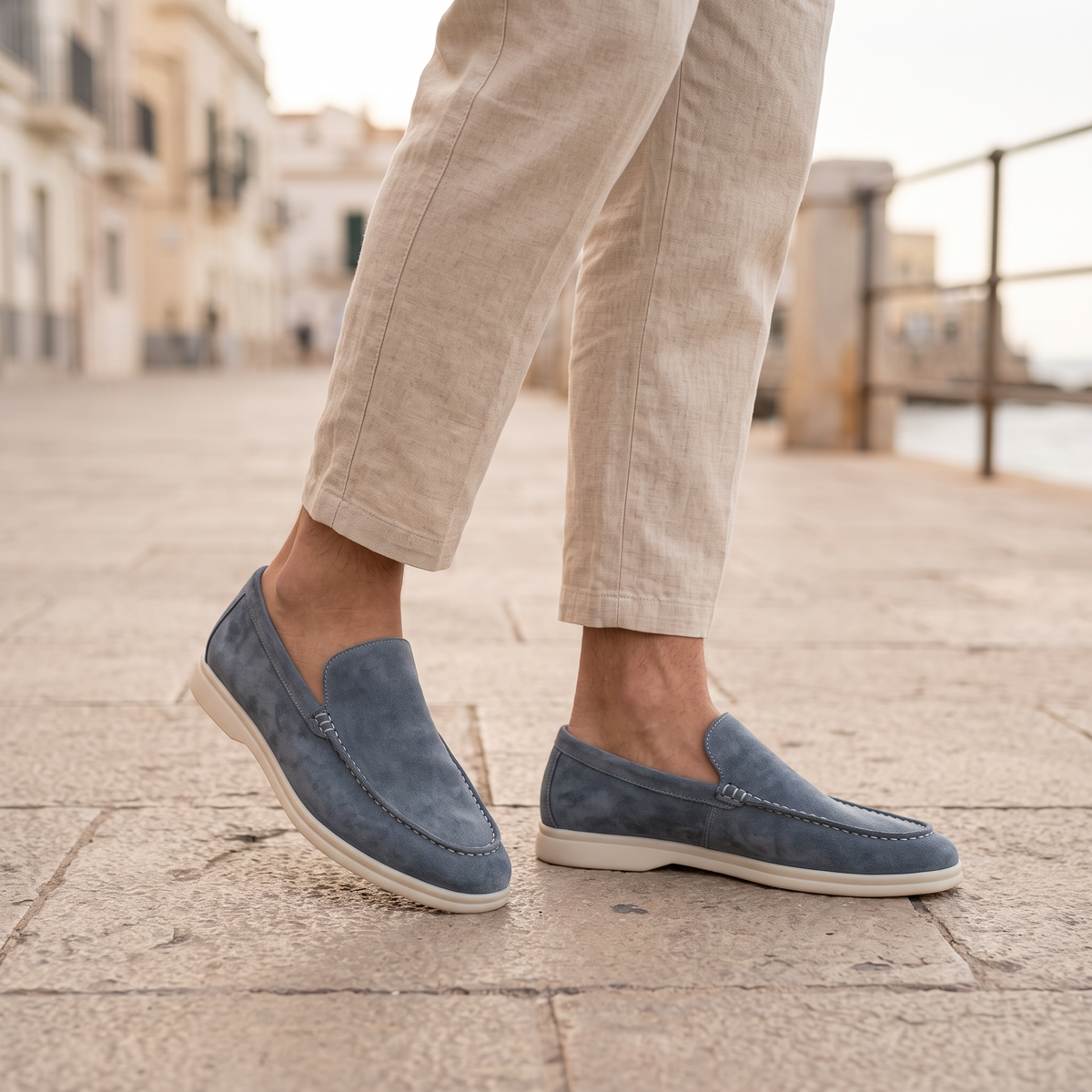 Everett Men's Slip-On Loafers in light blue on a beachside town promenade