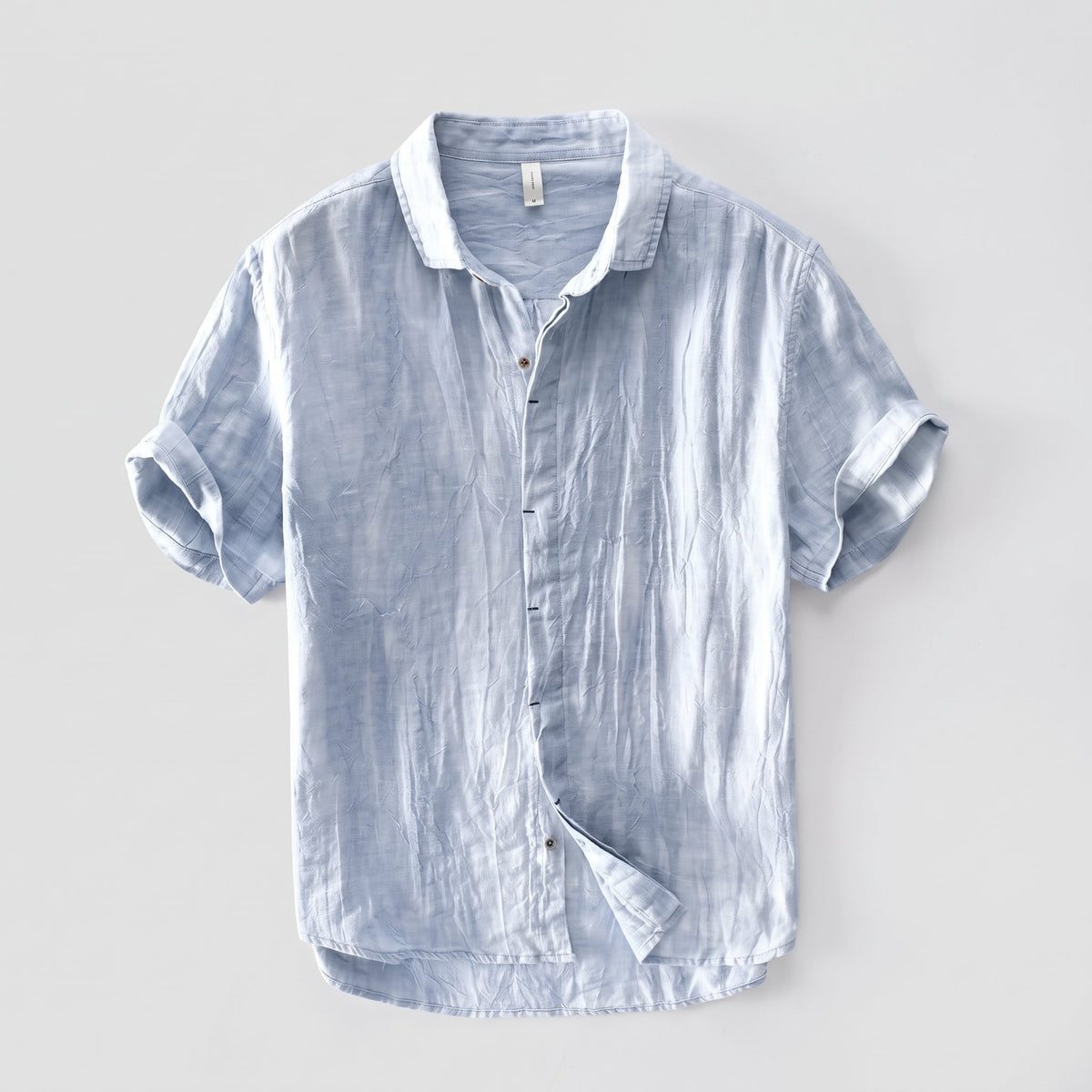 Kelso Men's Linen Button Up Shirt in Blue against a pale grey background
