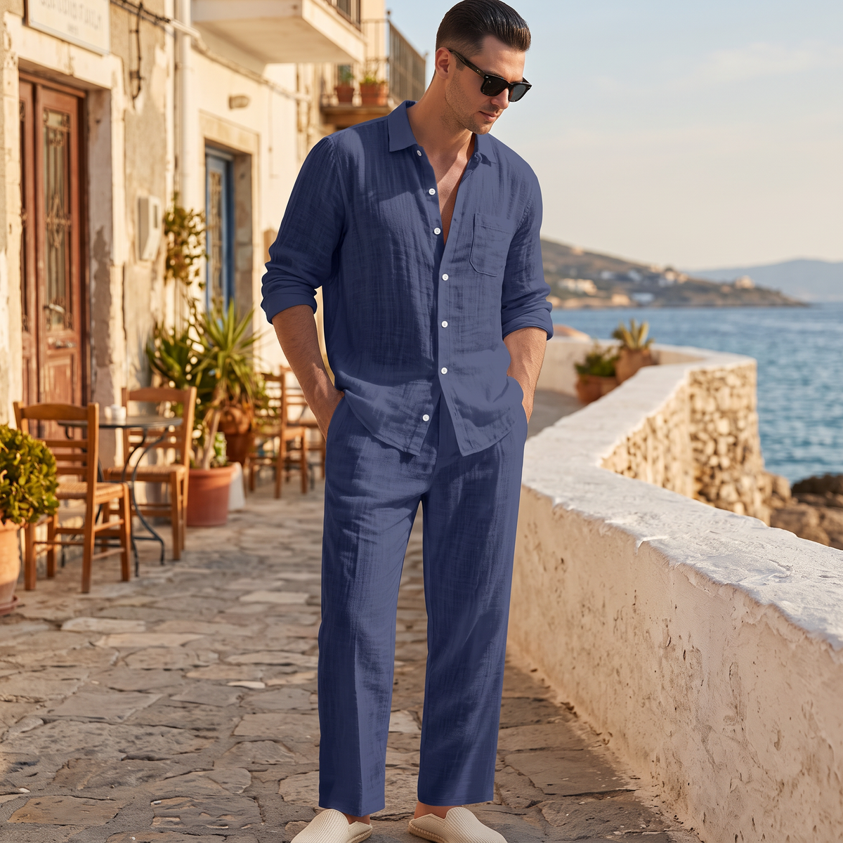 Lennox Men's Linen Blend Shirt and Trouser Set in dark blue on a beachside town terrace