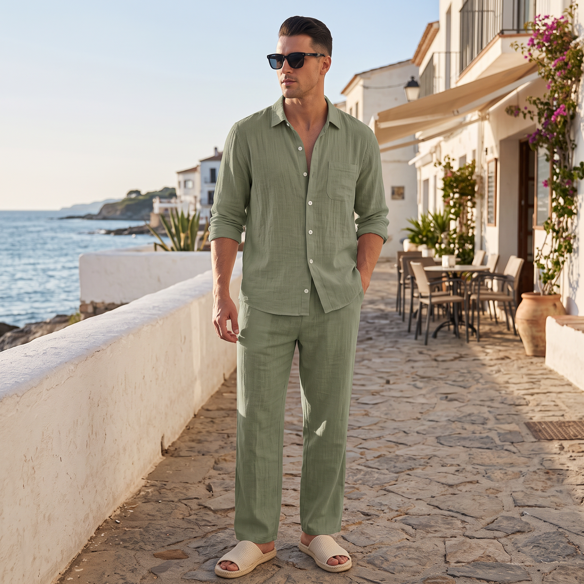 Lennox Men's Linen Blend Shirt and Trouser Set in dark green on a beachside town terrace